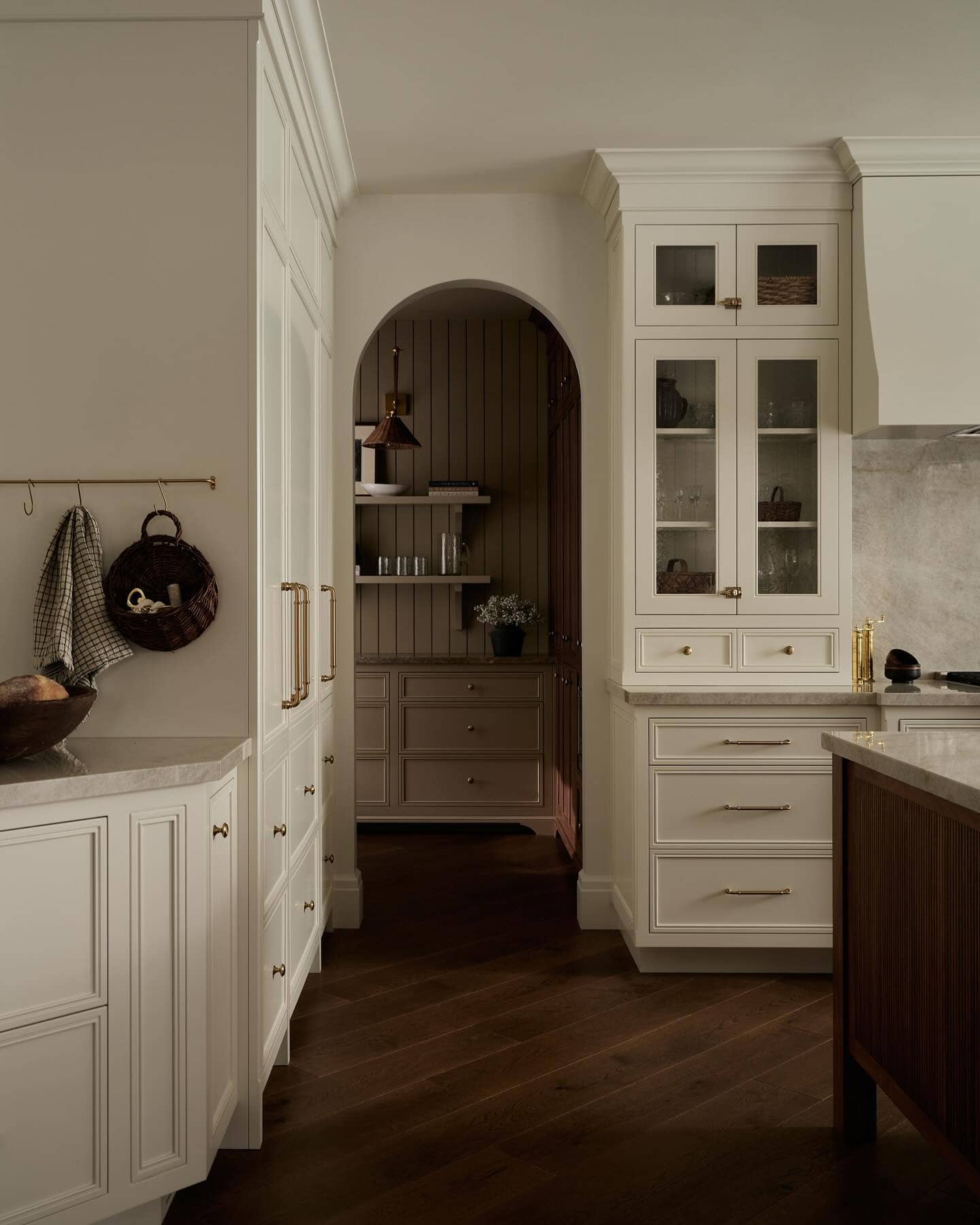 Neutral kitchen cabinet colors example featuring a modern traditional kitchen idea with warm white cabinets.