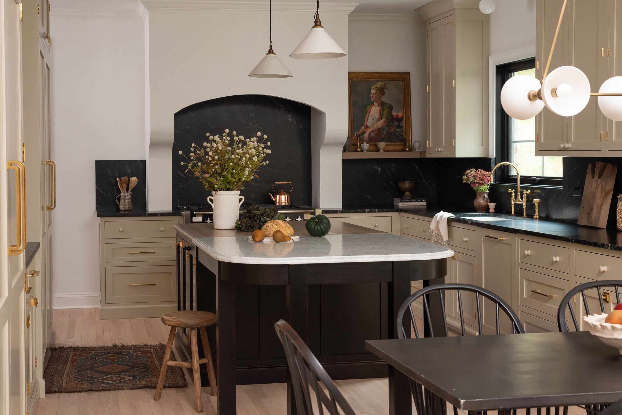 Neutral kitchen cabinet colors example featuring a modern traditional kitchen idea with warm toned gray cabinets.