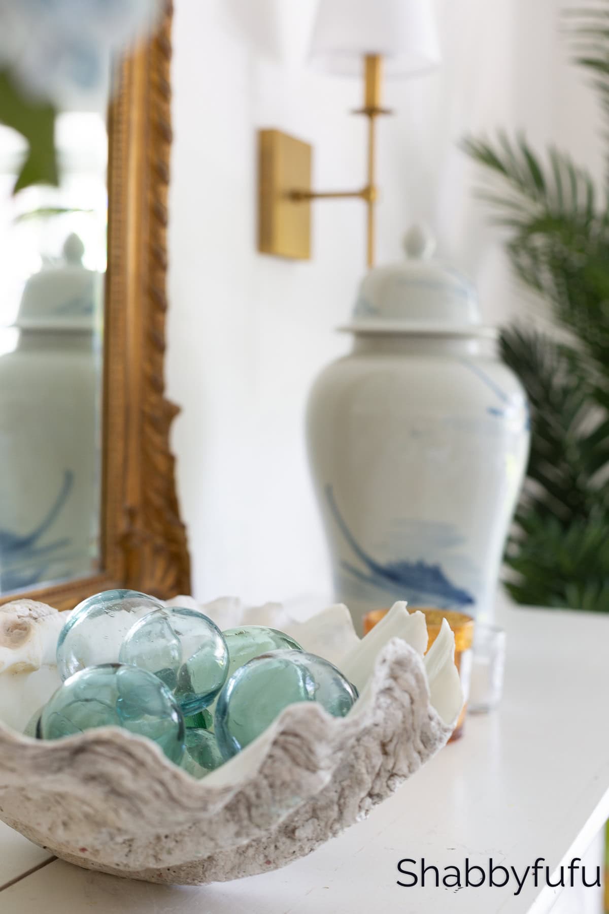 simplify your home for summer with a clamshell filled with fishing floats