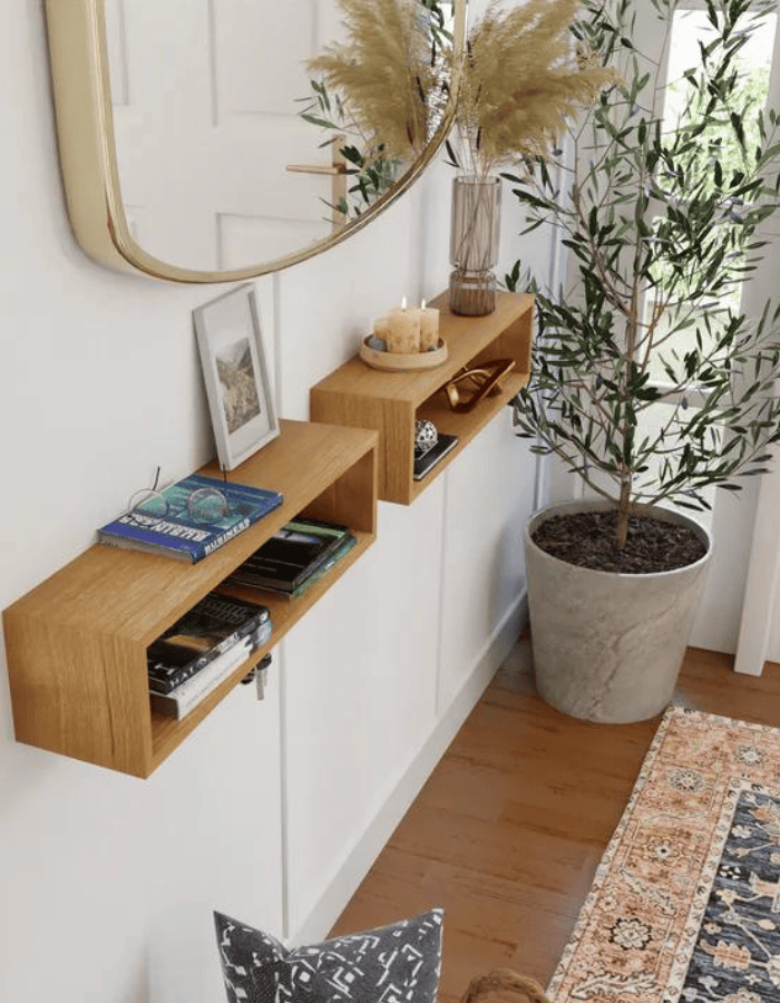 Example of modern foyer decorating ideas featuring floating shelf