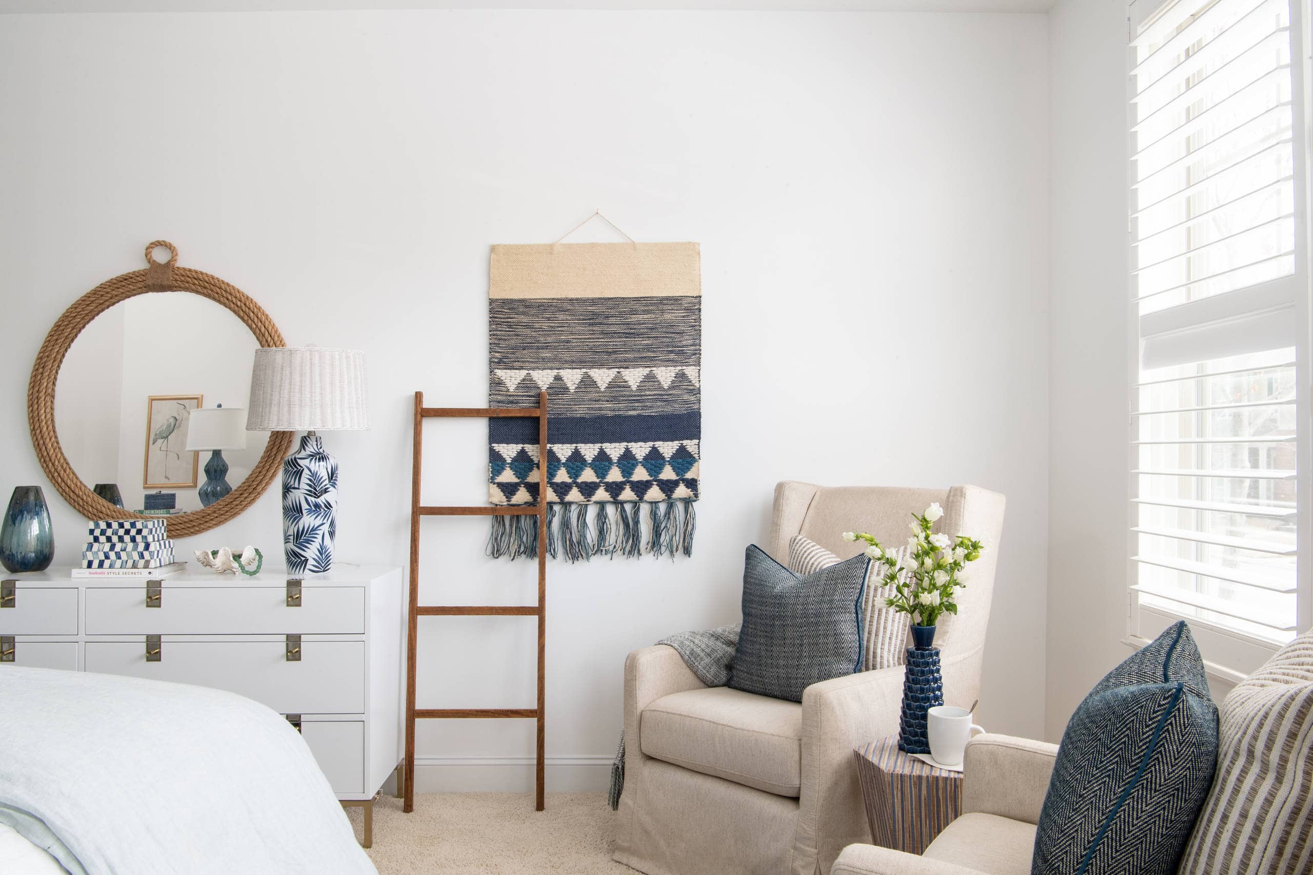 Modern beach style bedroom with wood flooring and coastal accents