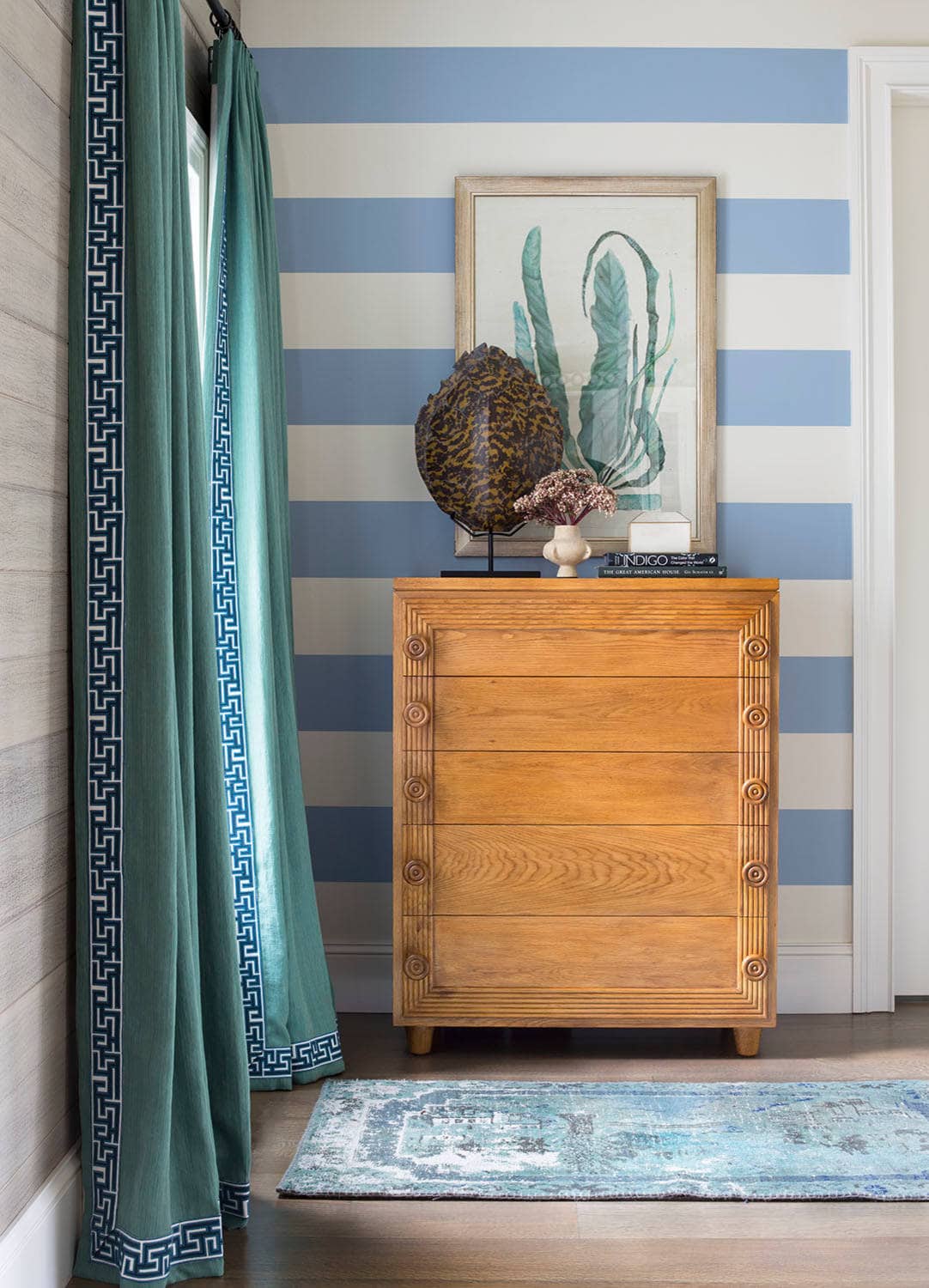 Coastal lake house with colorful tropical accents featuring a hallway