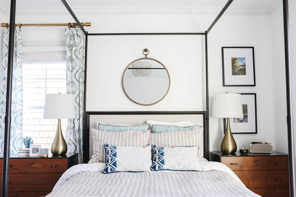 Modern beach style bedroom with wood flooring and coastal accents