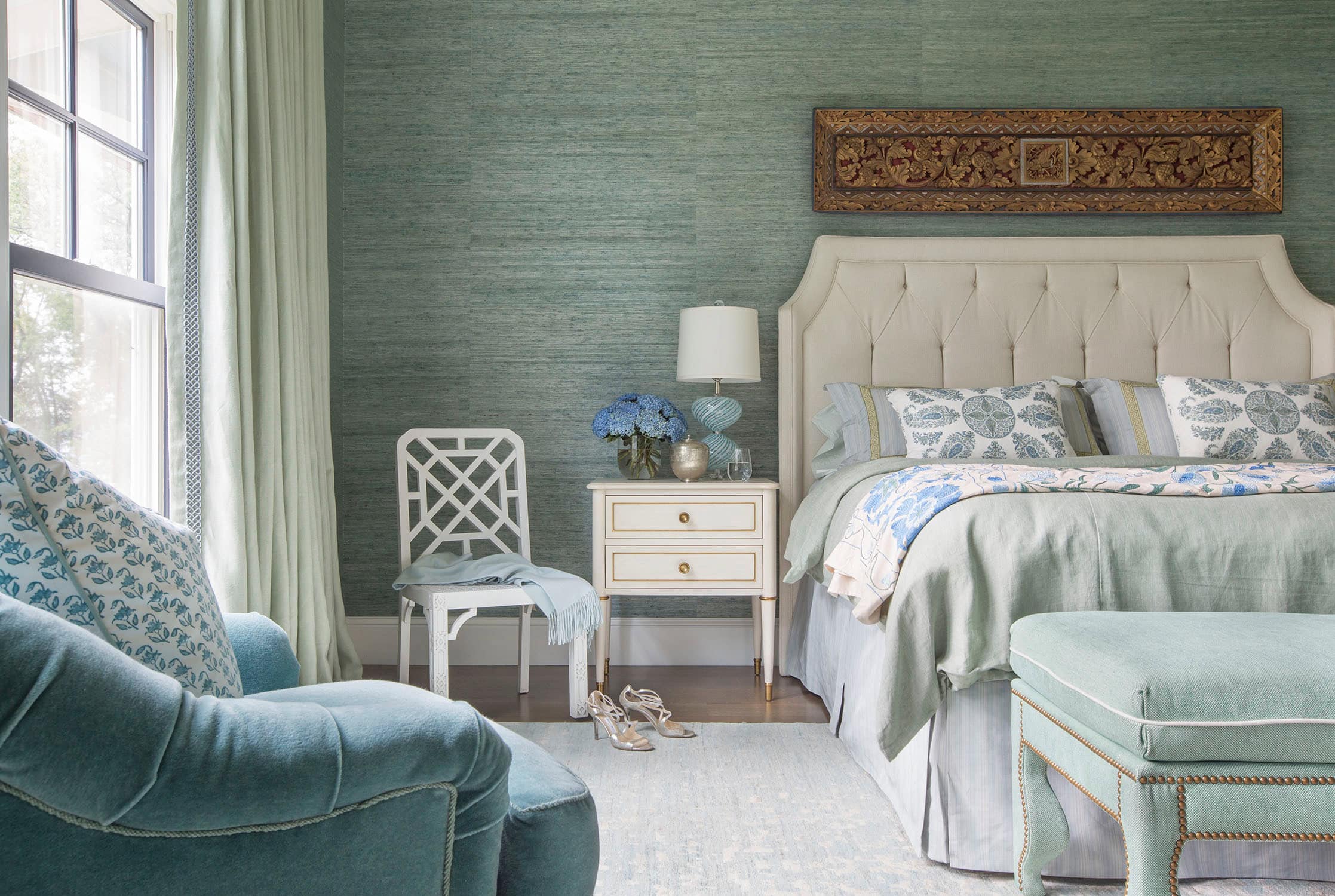 Coastal lake house with colorful tropical accents featuring a bedroom