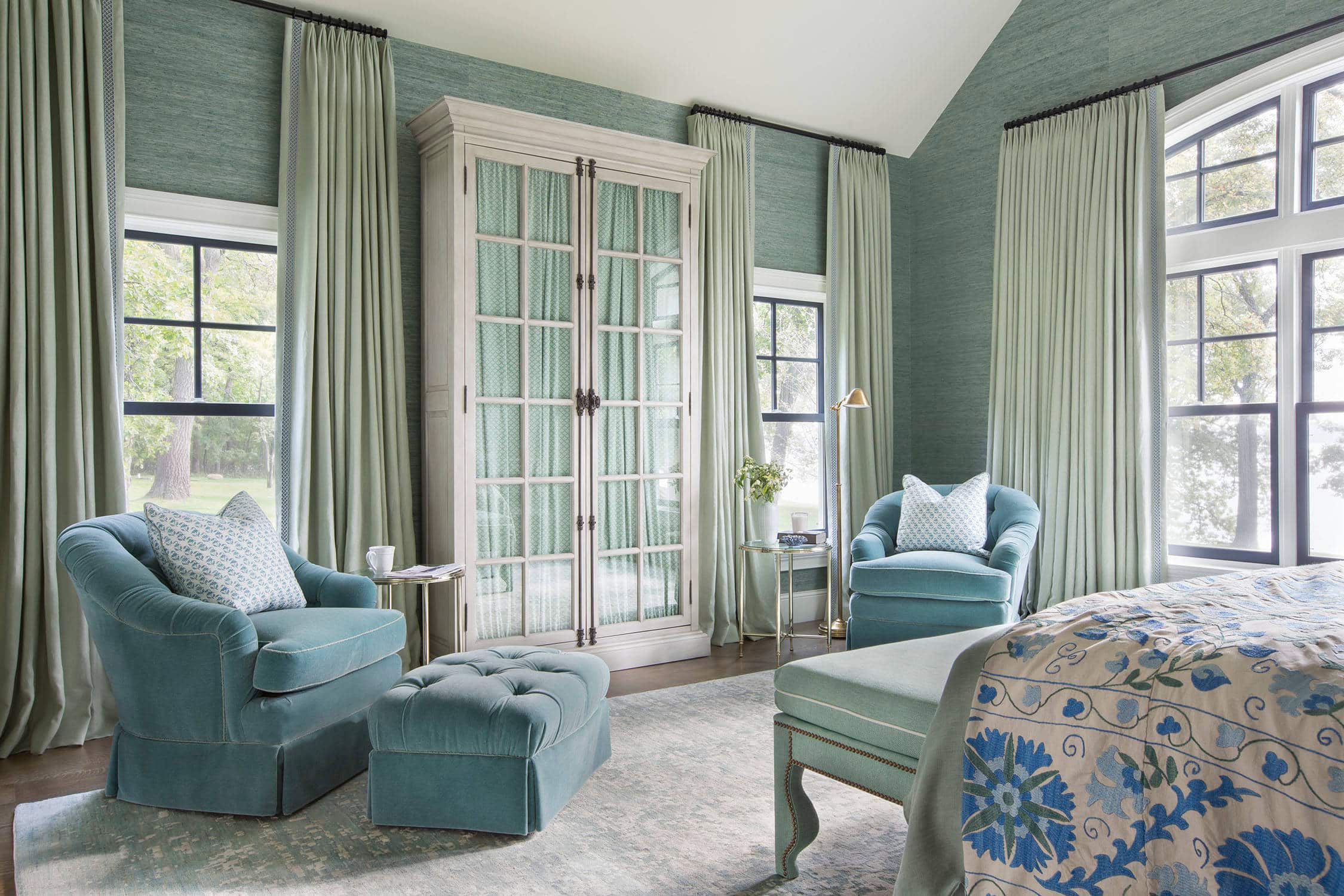 Coastal lake house with colorful tropical accents featuring a bedroom