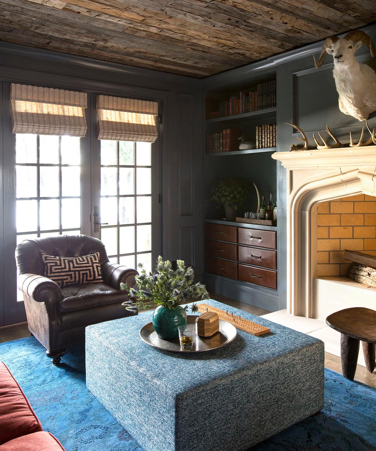 Coastal lake house with colorful tropical accents featuring a family room