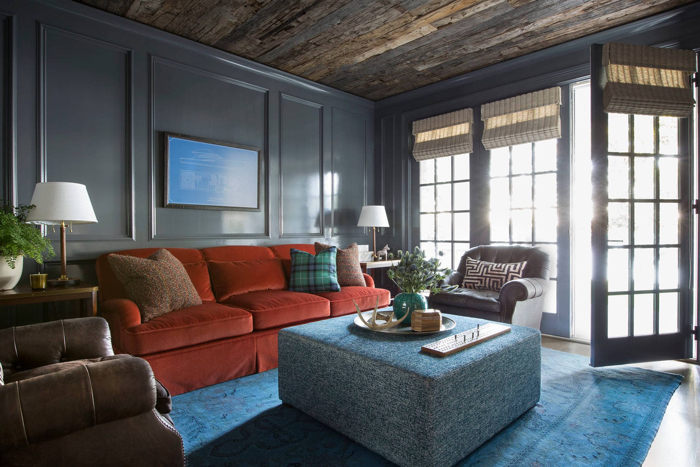 Coastal lake house with colorful tropical accents featuring a family room