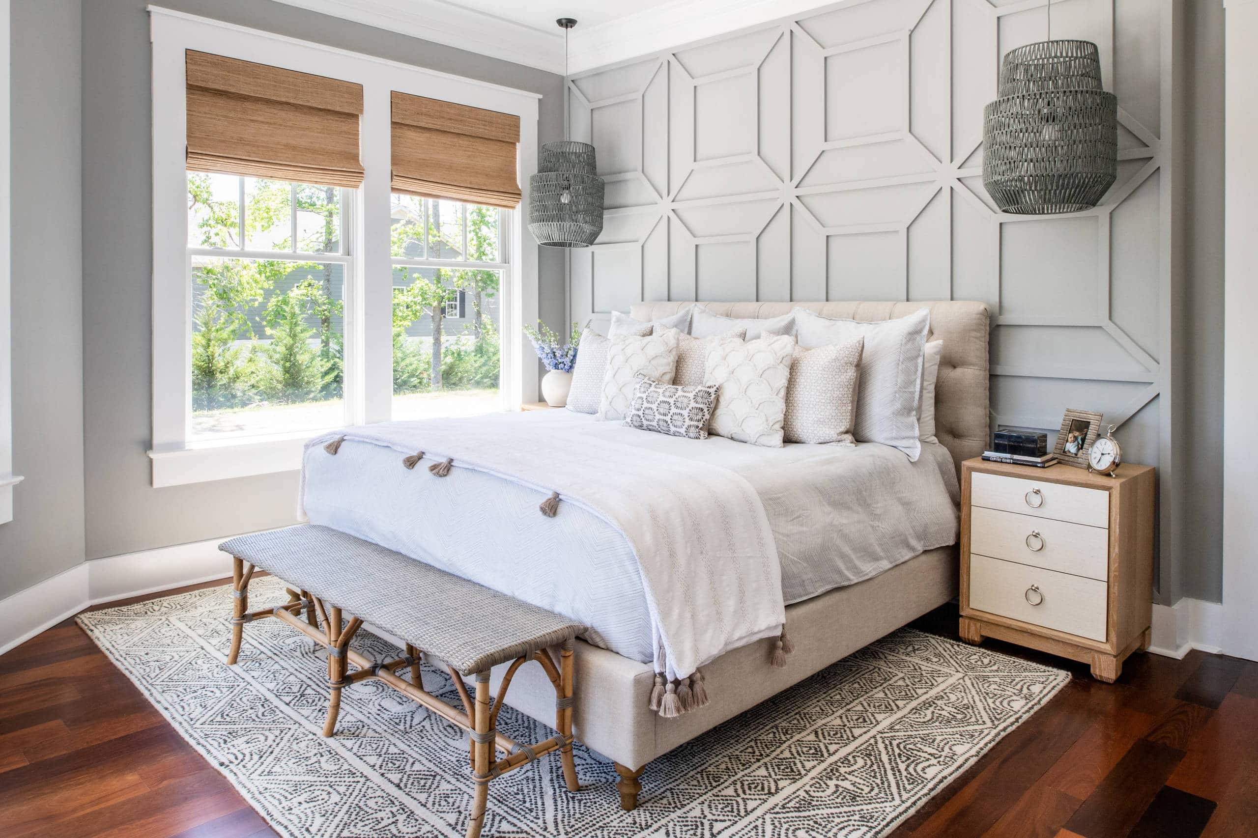 Modern beach style bedroom with wood flooring and coastal accents
