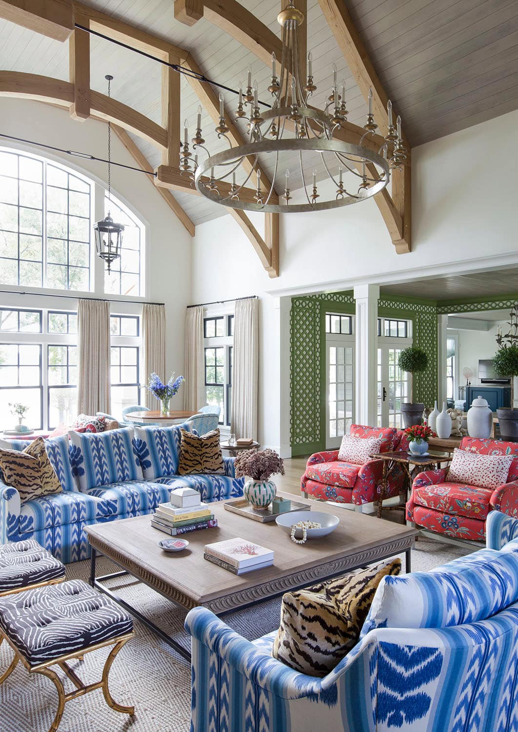 Coastal lake house with colorful tropical accents featuring a living room