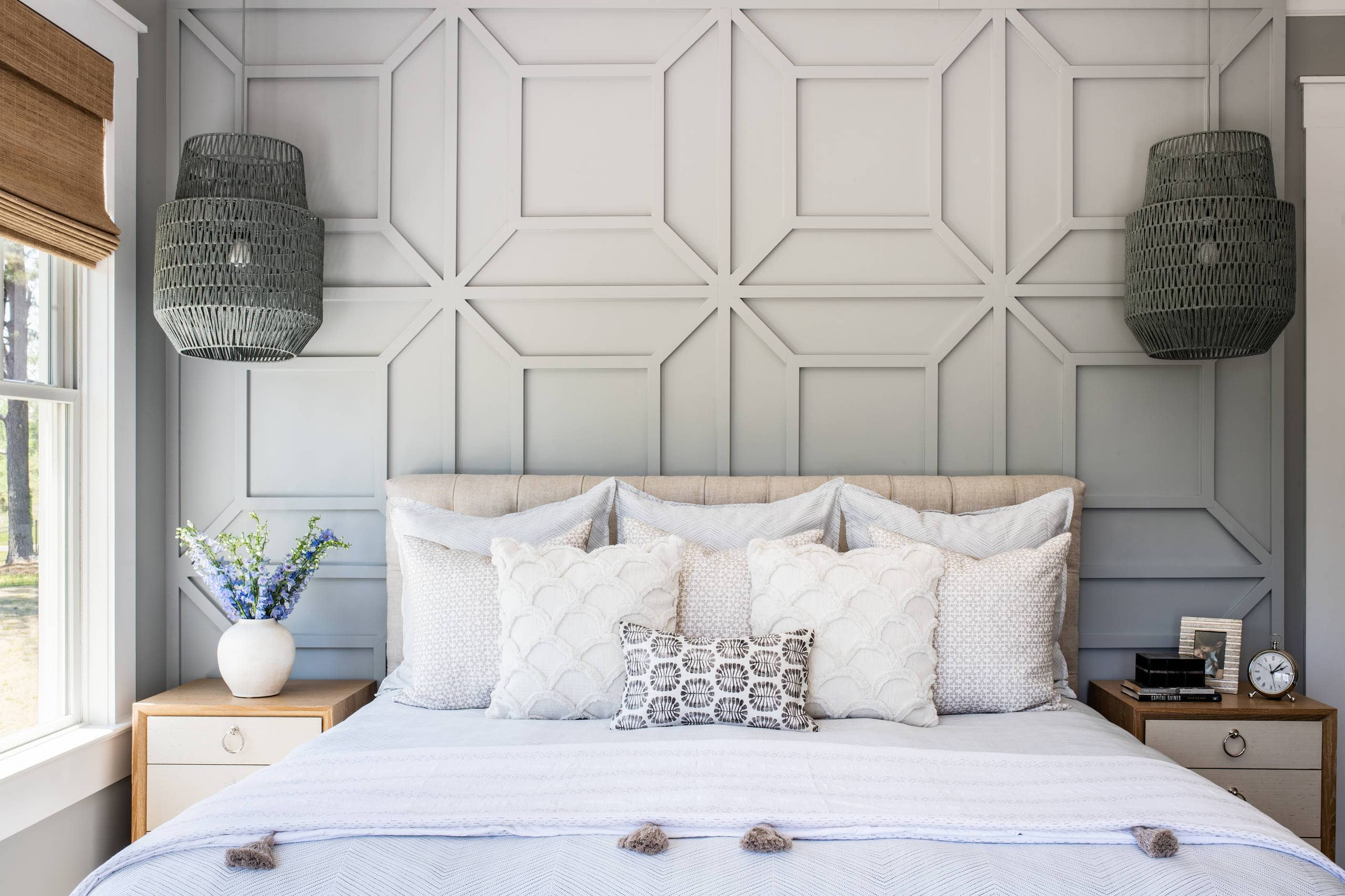 Modern beach style bedroom with wood flooring and coastal accents