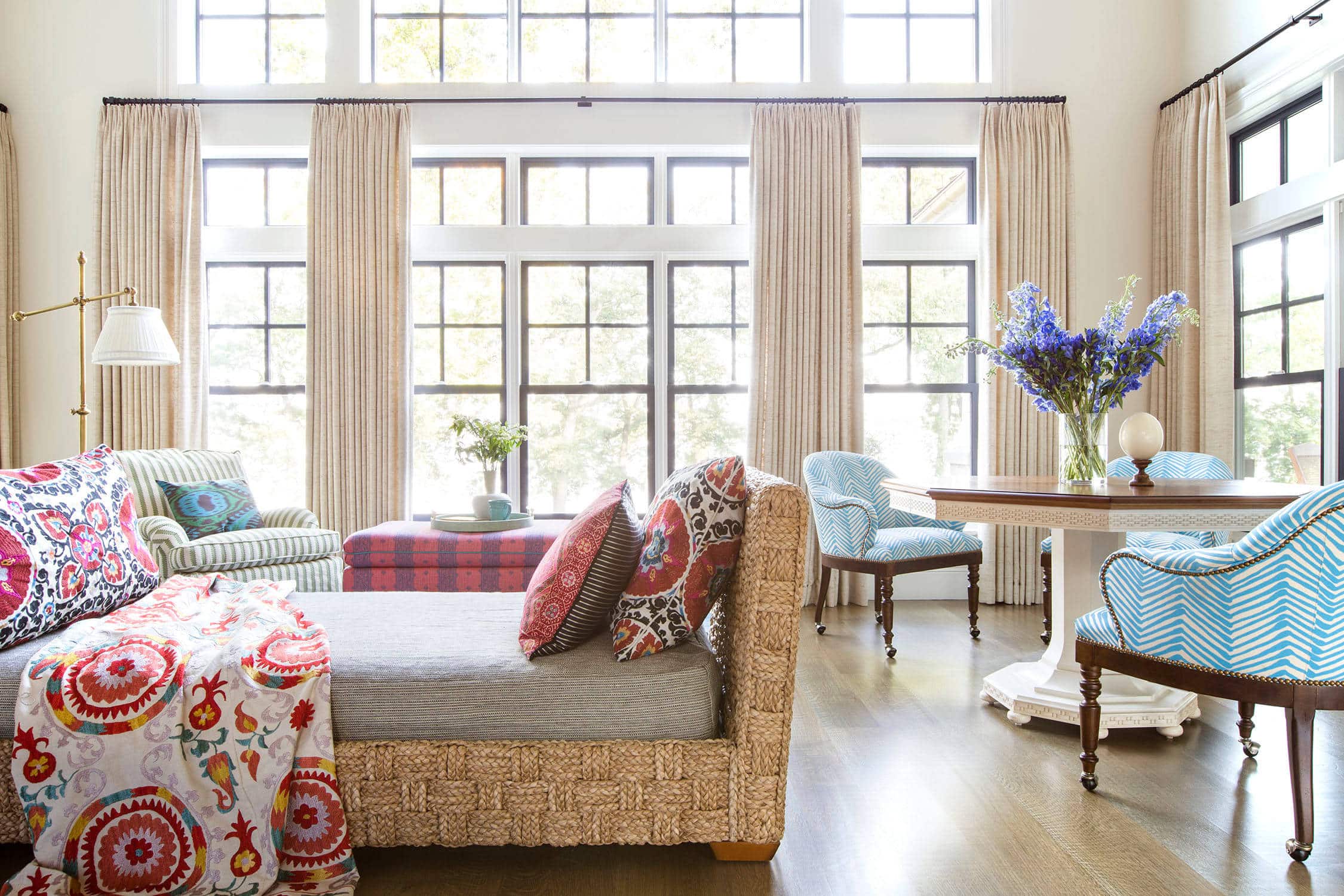 Coastal lake house with colorful tropical accents featuring a living room