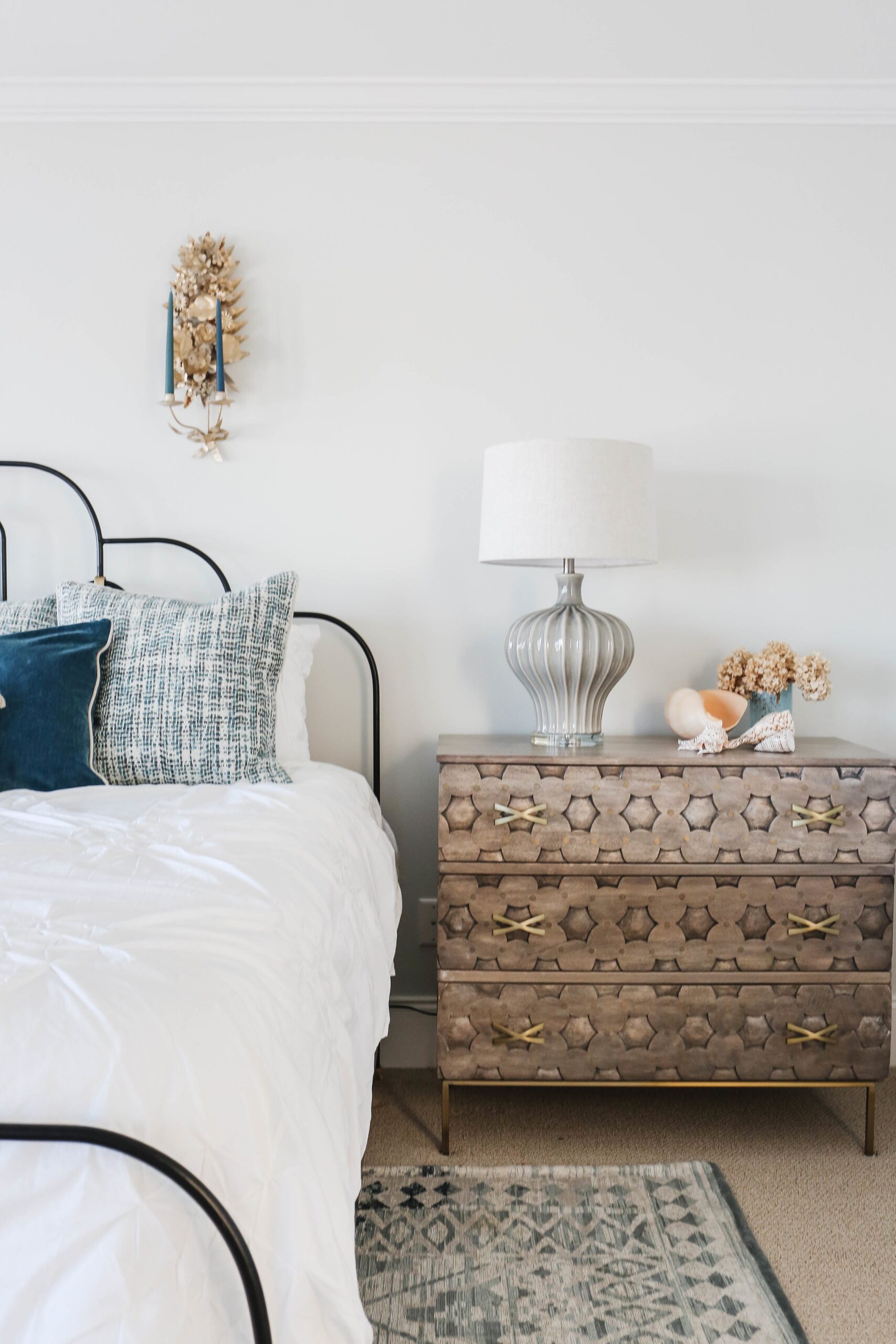 Modern beach style bedroom with wood flooring and coastal accents