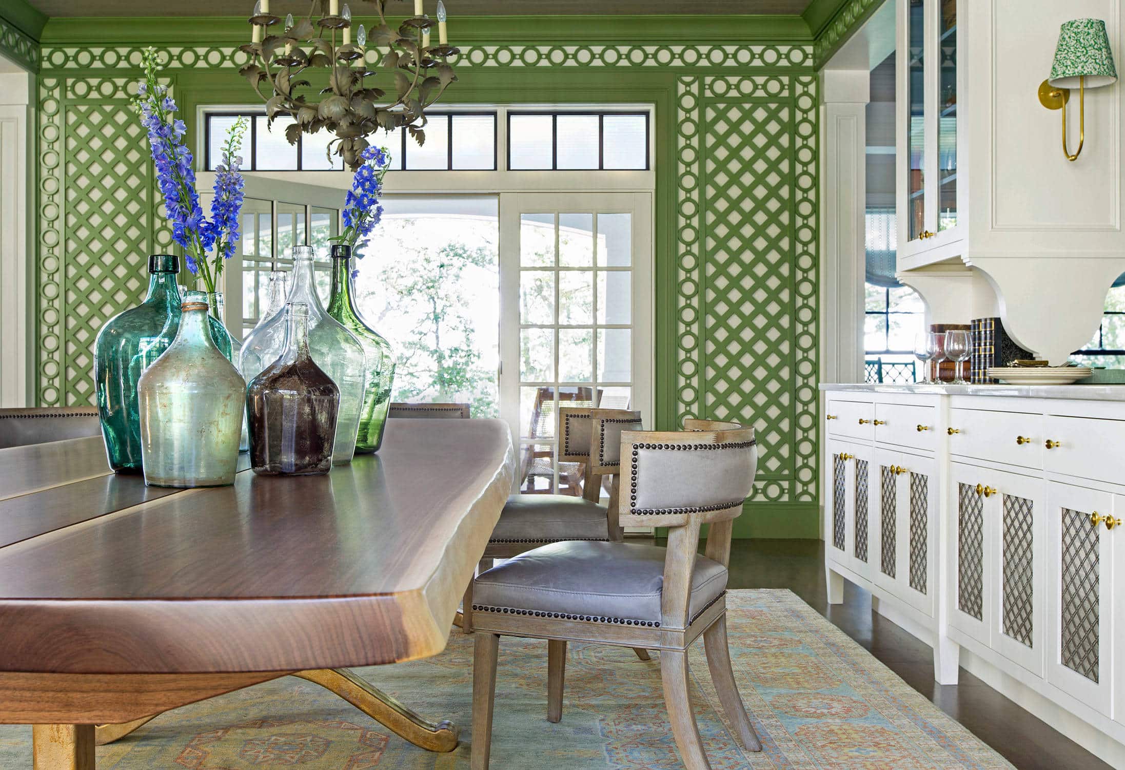 Coastal lake house with colorful tropical accents featuring a dining room