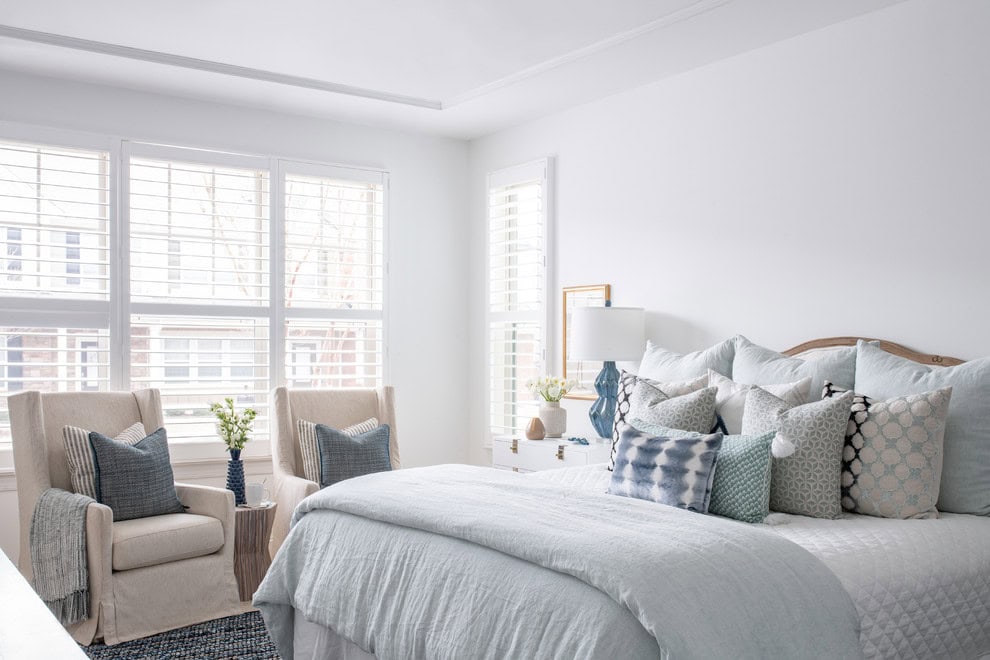Modern beach style bedroom with wood flooring and coastal accents