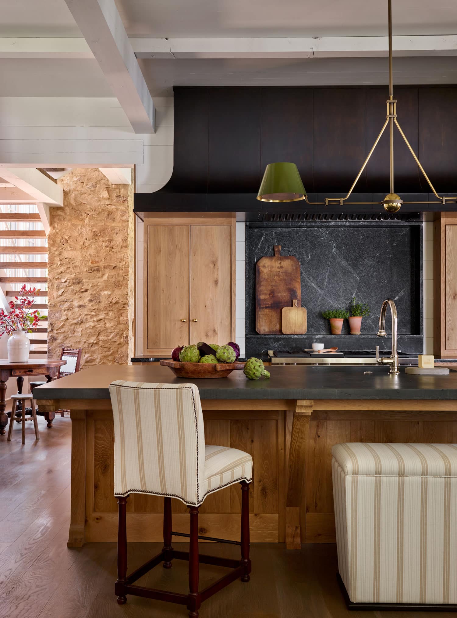 Designer Spotlight about Ashley Gilbreath Interiors Design project featuring a kitchen in a traditional style mixed with coastal and modern home accents.