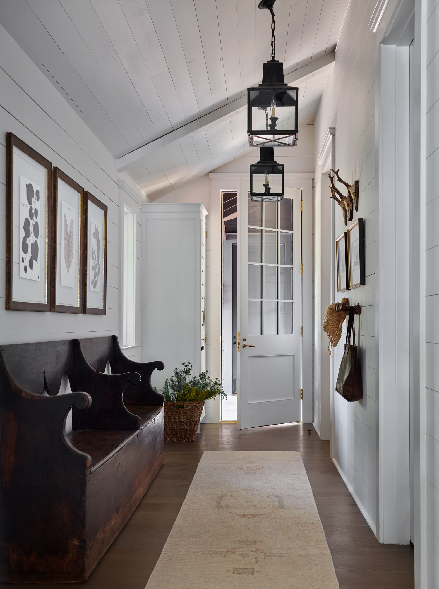Designer Spotlight about Ashley Gilbreath Interiors Design project featuring a entryway in a traditional style mixed with coastal and modern home accents.