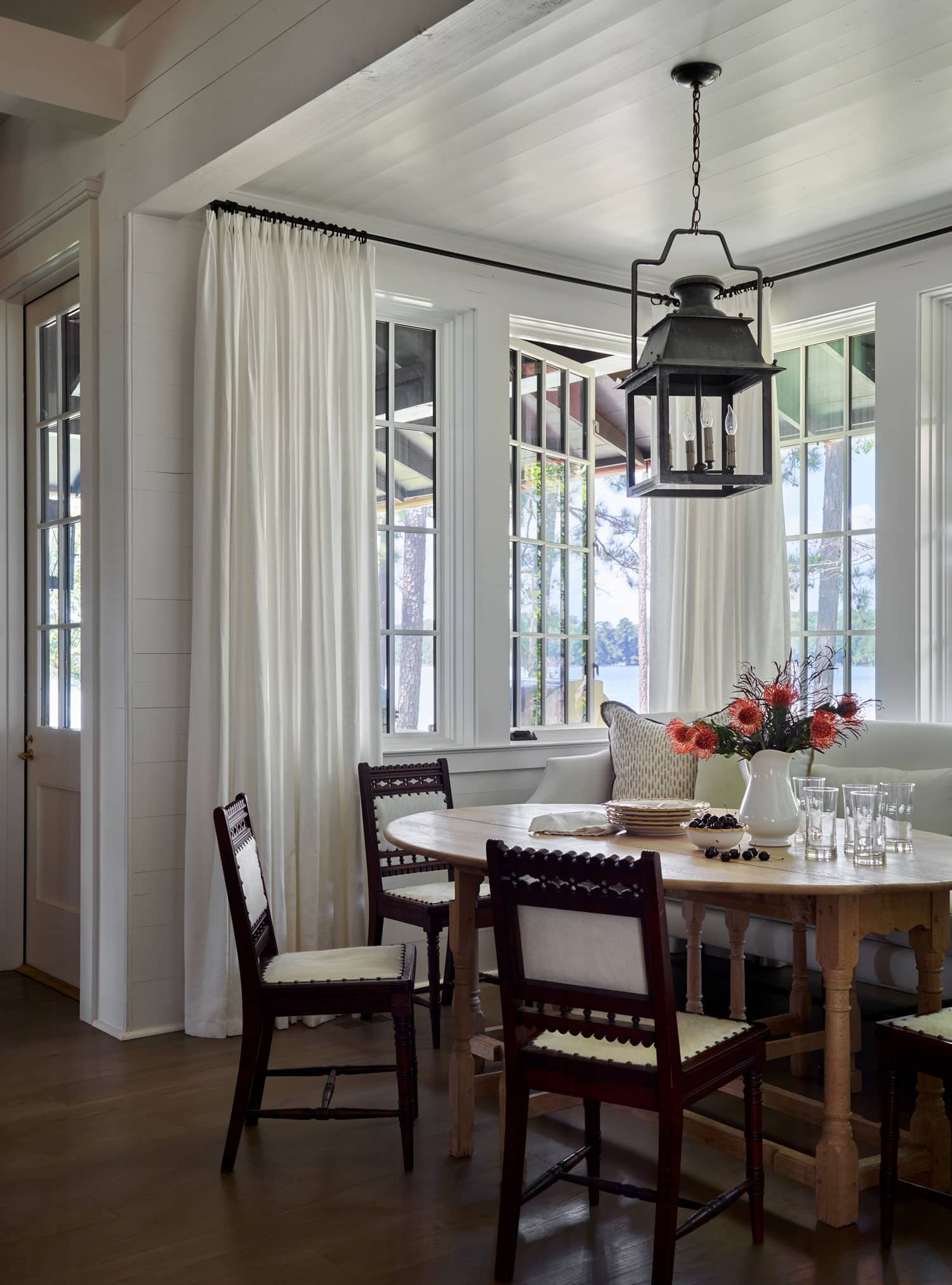 Designer Spotlight about Ashley Gilbreath Interiors Design project featuring a breakfast nook in a traditional style mixed with coastal and modern home accents.