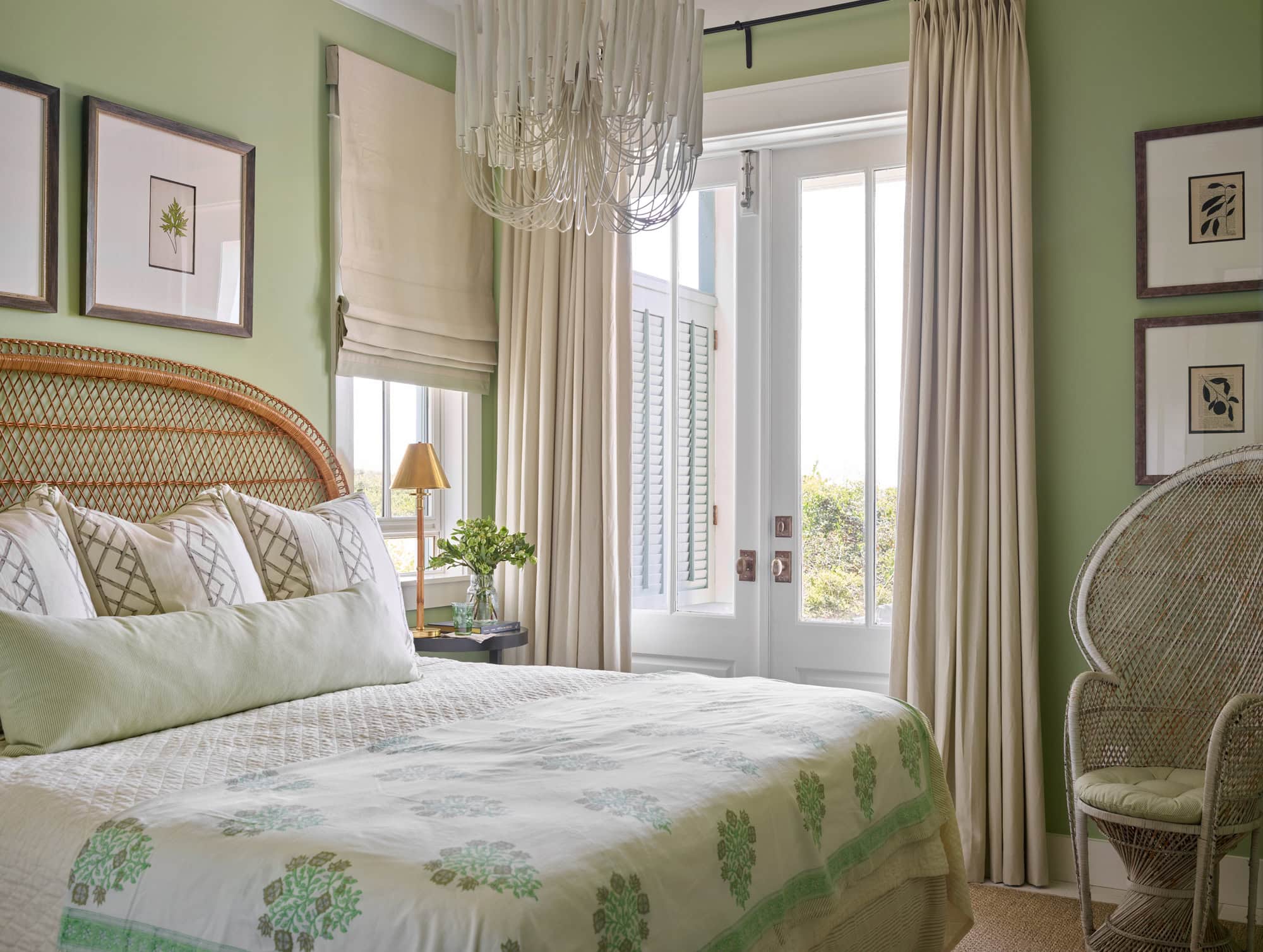 Designer Spotlight about Ashley Gilbreath Interiors Design project featuring a bedroom with pops of green and rustic textures in a tropical style mixed with traditional and modern home accents.