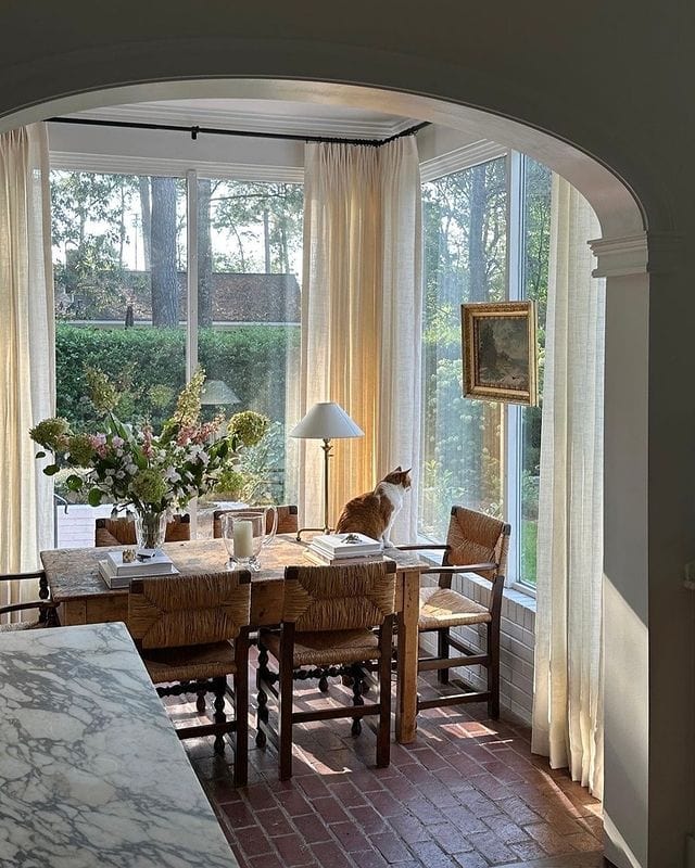 Dining room traditional style featuring large arched windows