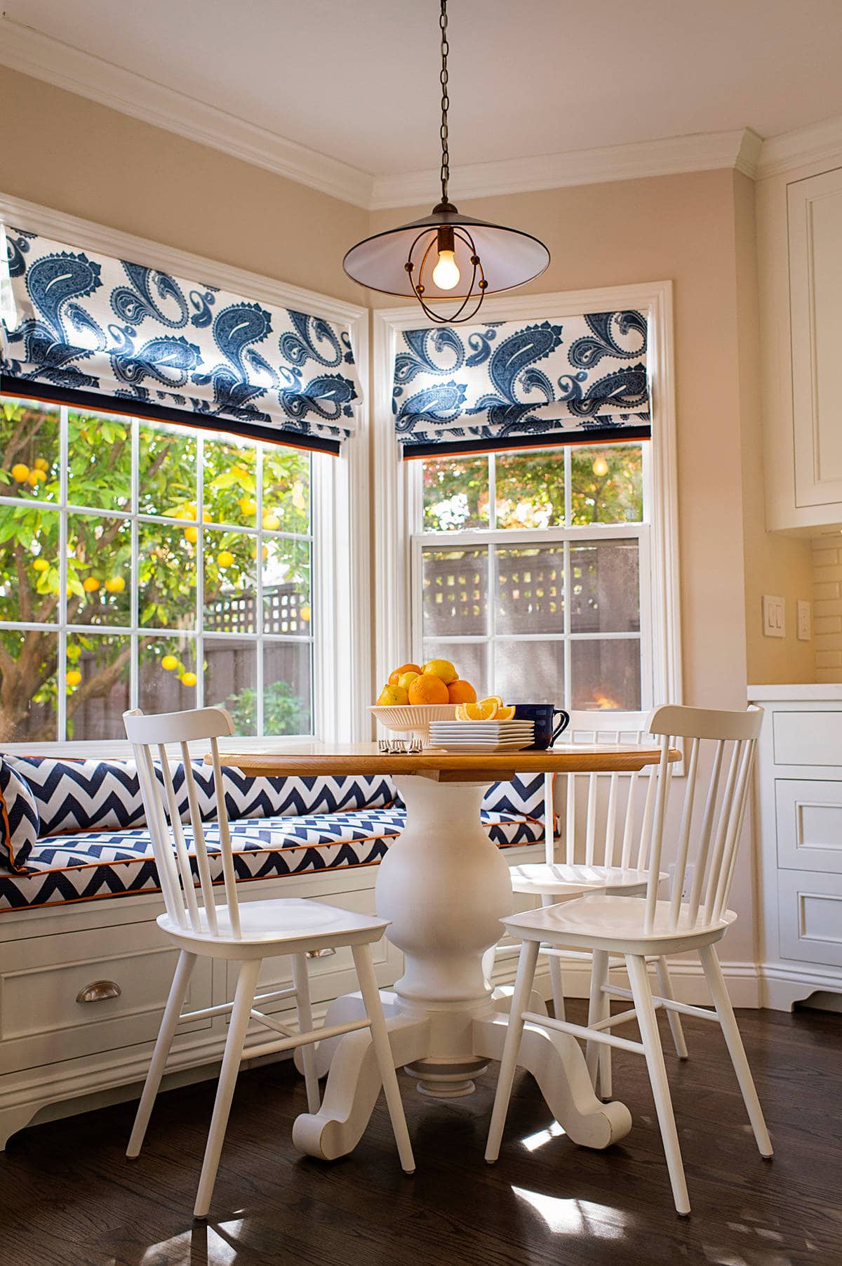 Cozy breakfast nook with bench in patterned blue and white fabric featured as part of focal point tips