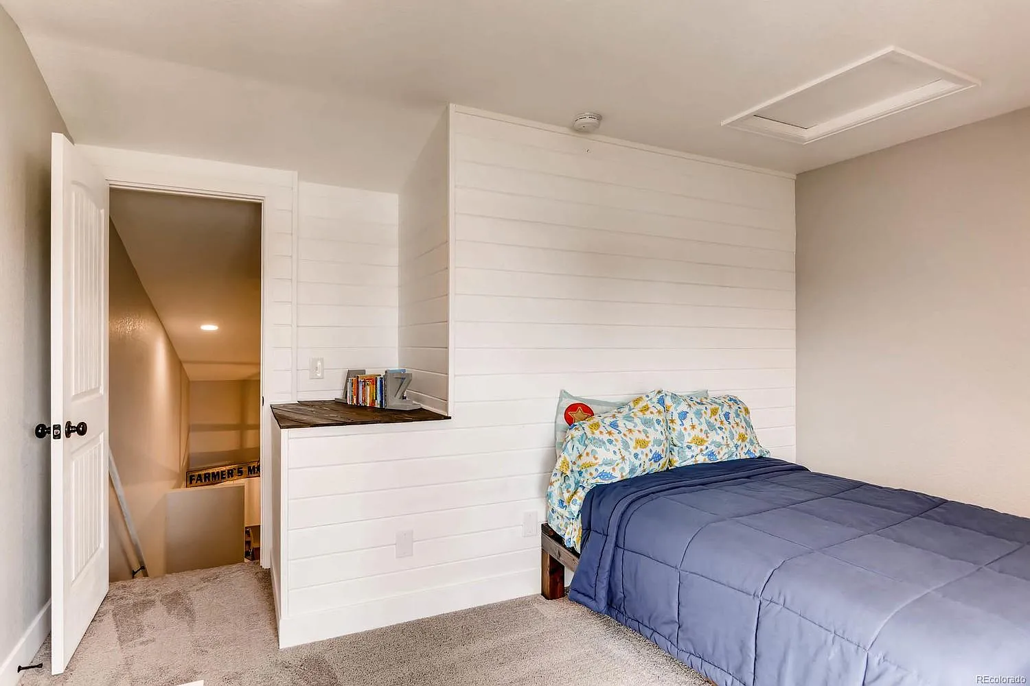 DIY home renovation of a Colorado condo, showcasing the before and after transformation of the kitchen with painted cabinets and open shelving