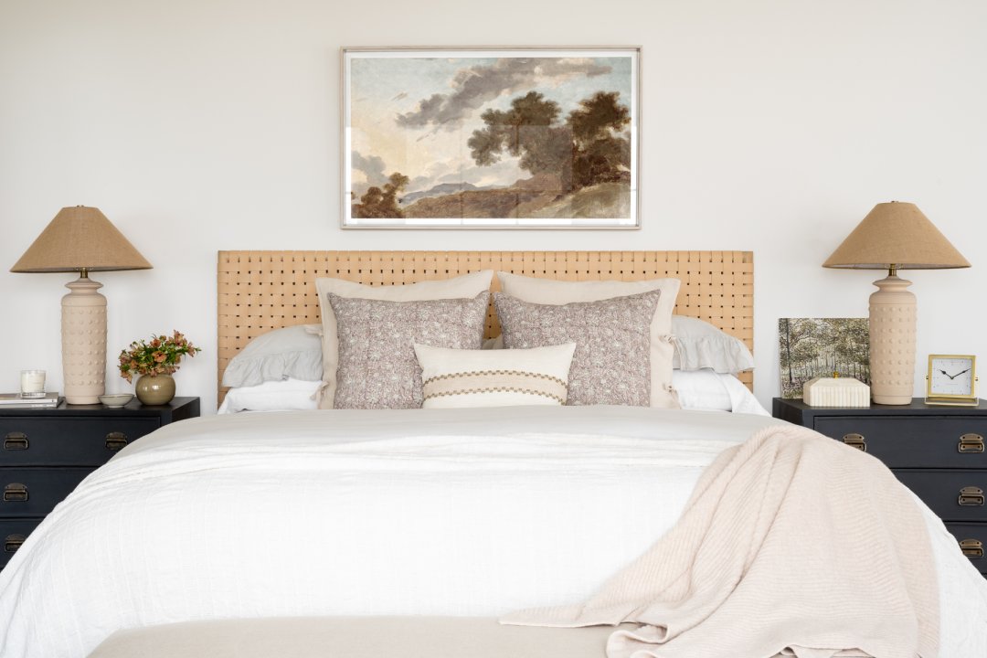 Example of throw pillow combo in transitional style bedroom in light color scheme of neutrals