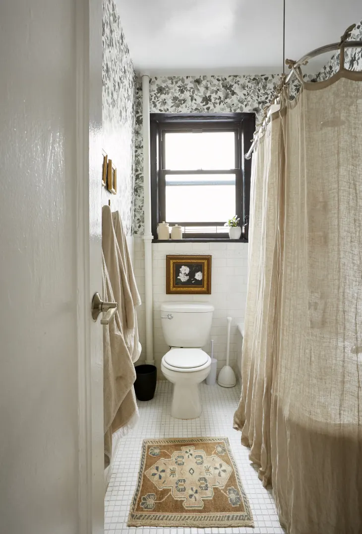 Fall bathroom decor idea featuring a relaxed boho space with rustic linen curtains