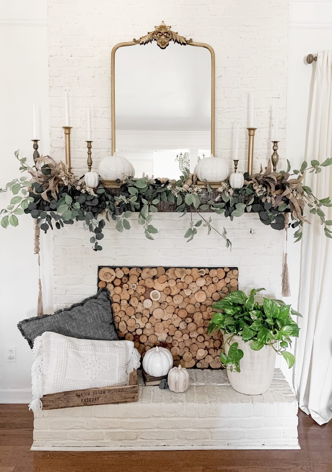 Fall mantel ideas for living room decor featuring a classic mantel
