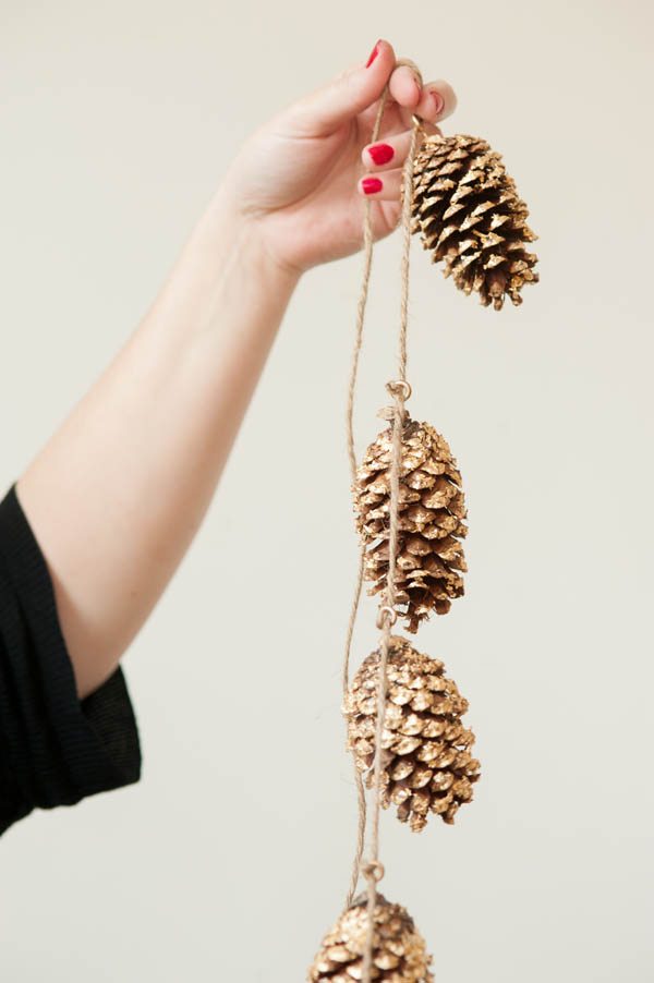 Fall decor idea featuring pinecone and yarn pinecones inspired by the dollar store