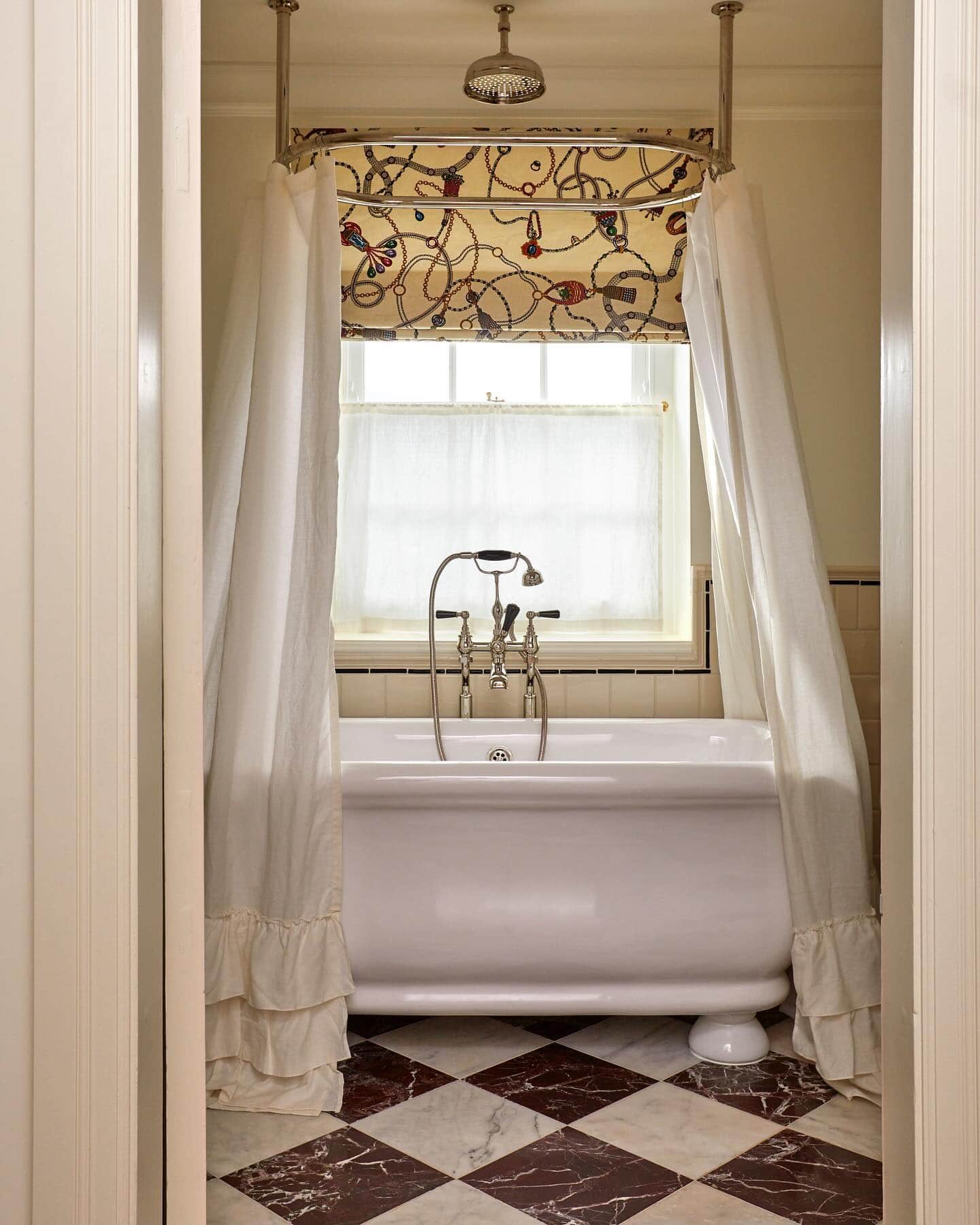 Fall bathroom decor idea featuring a bathtub with a canopy shower curtain