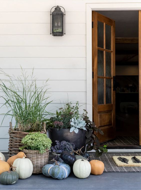 Example of fall porch decorations featuring neutral porch front door