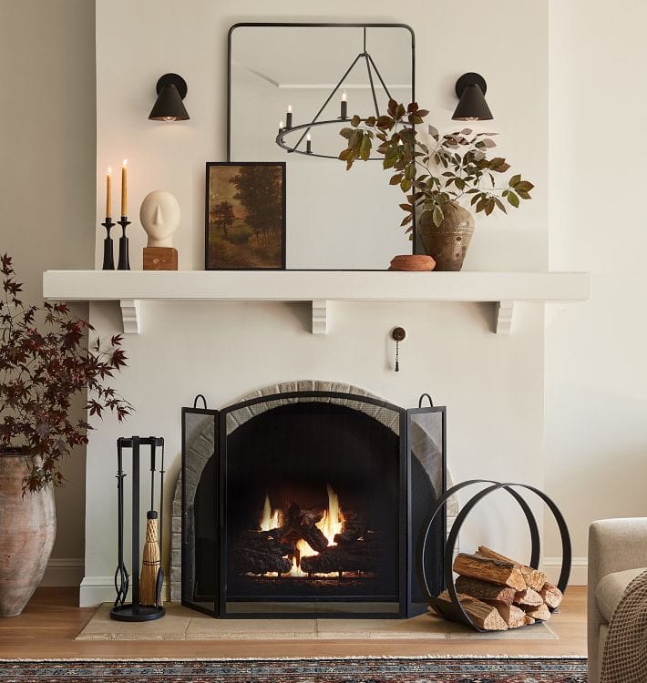 Fall decor for living room idea featuring fall mantel piece above fireplace in traditional modern living room