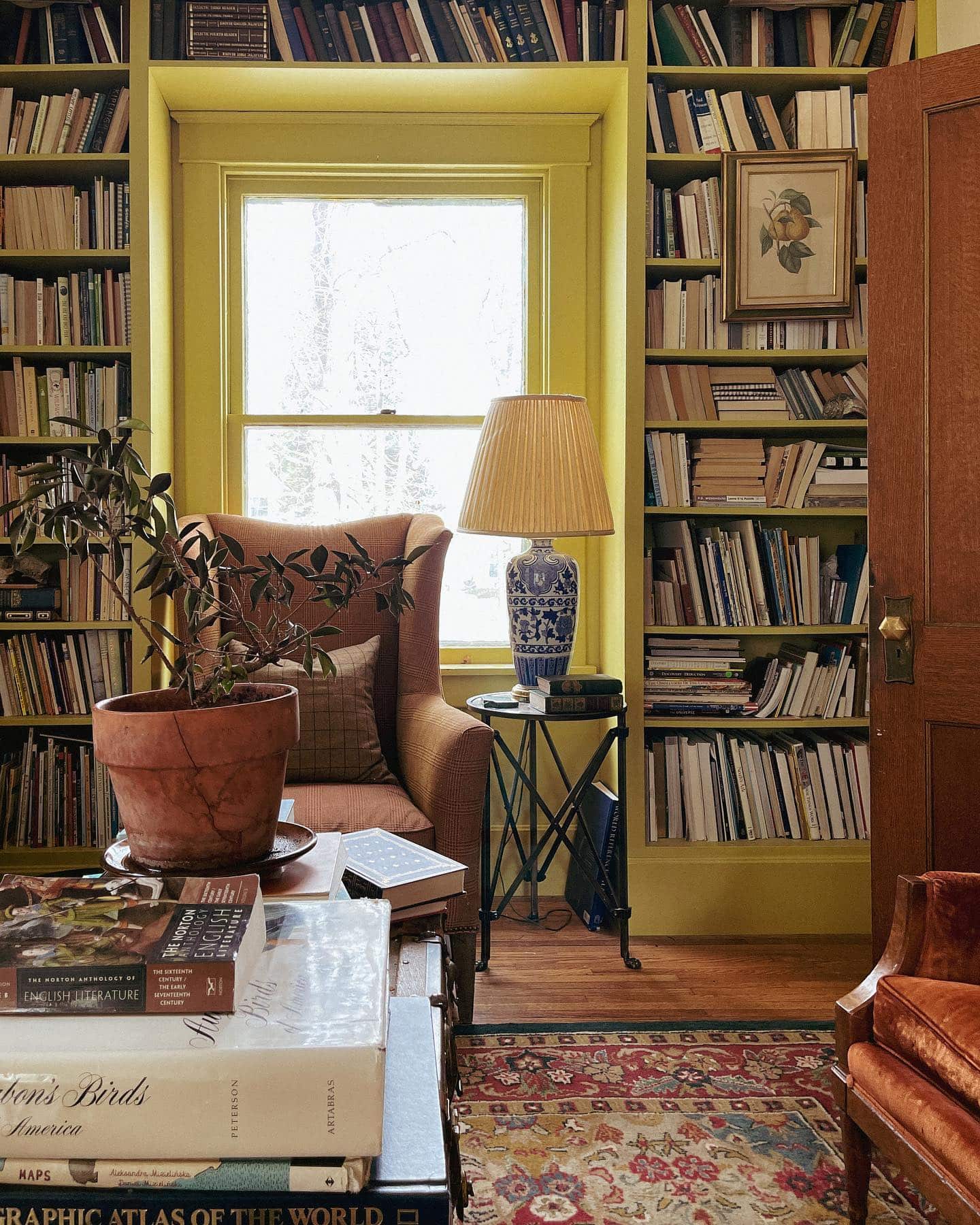 Fall decor for living room idea featuring built in bookcase in yellow
