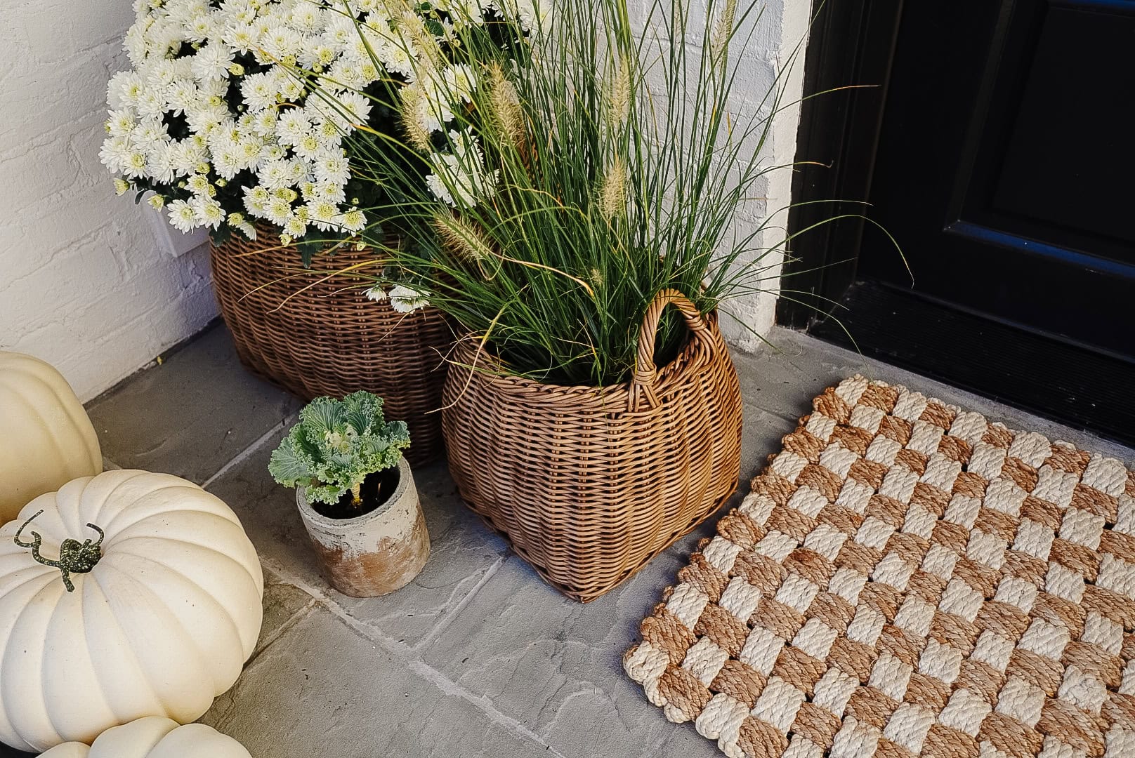 Example of minimalist fall decor ideas featuring basket in a porch