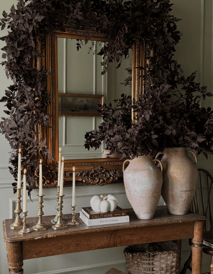 Fall mantel ideas for living room decor featuring a traditional moody fireplace mantel