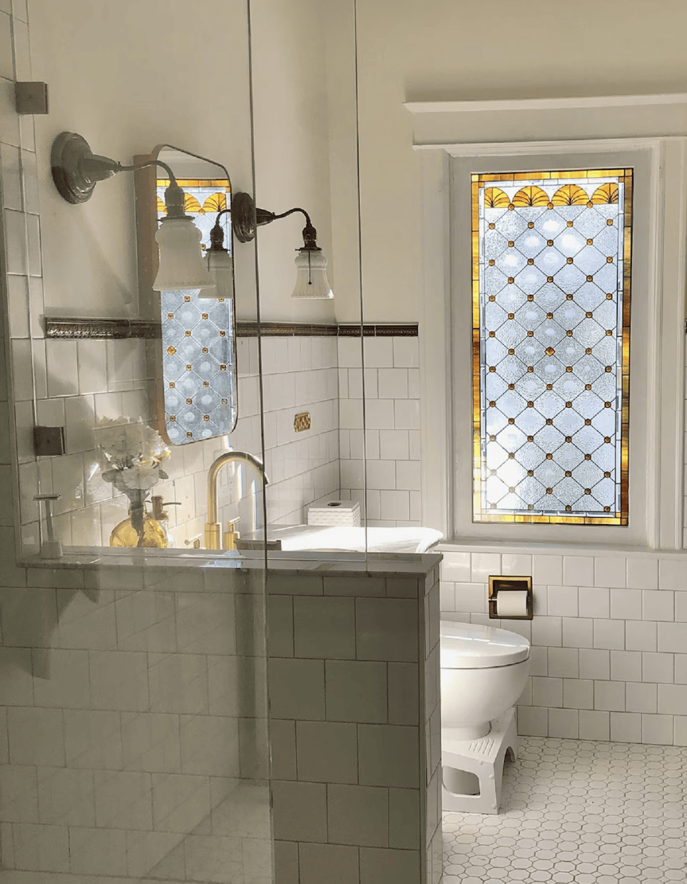 Fall bathroom decor idea featuring a colored stained glass window