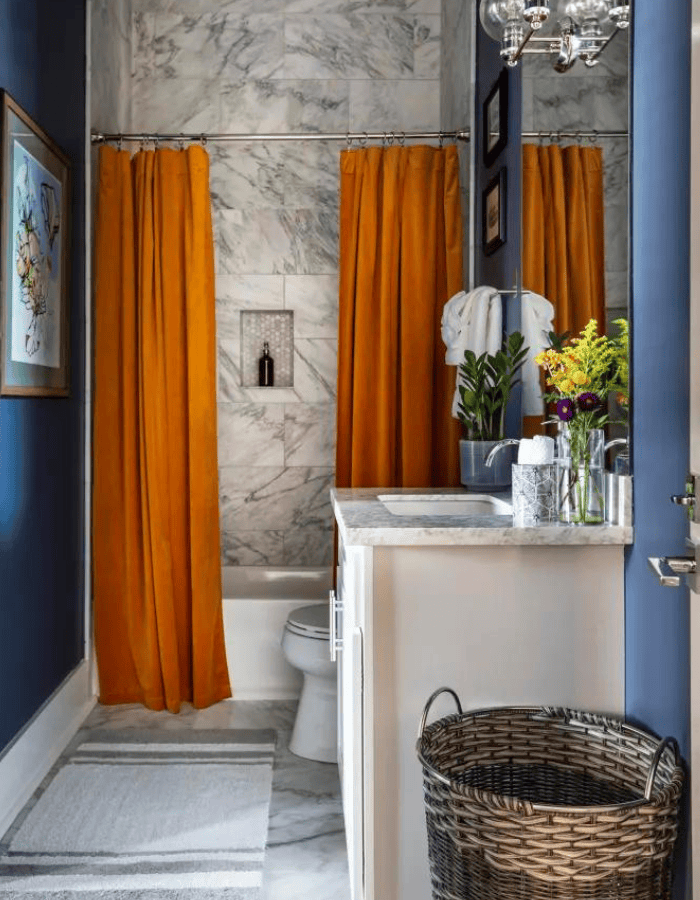 Fall bathroom decor idea featuring orange and blue color combo