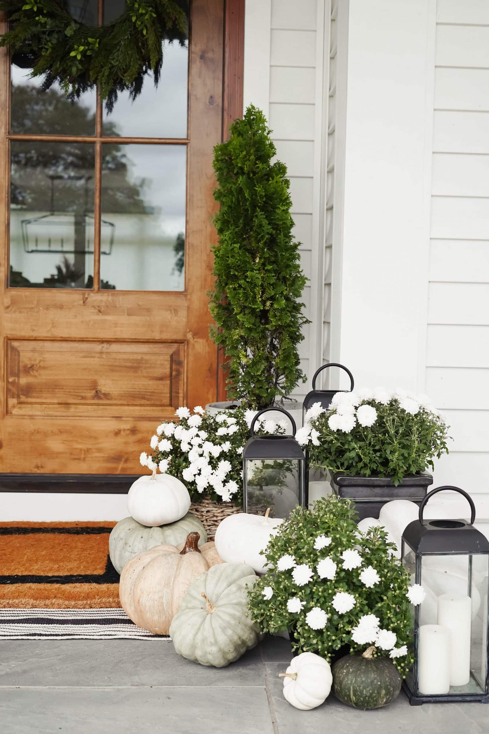 Example of minimalist fall decor ideas featuring basket in a porch