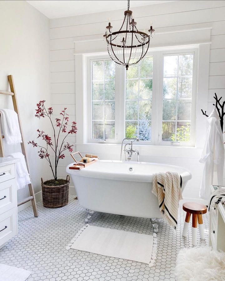 Fall bathroom decor idea featuring a all-white color scheme with rustic touches
