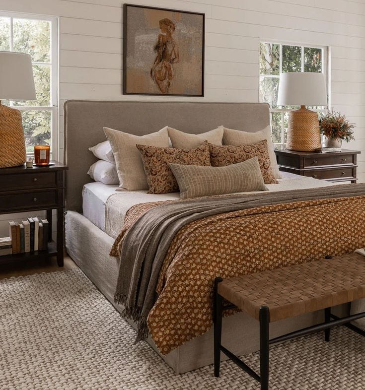 Example of throw pillow combo in earthy bedroom in warm hues
