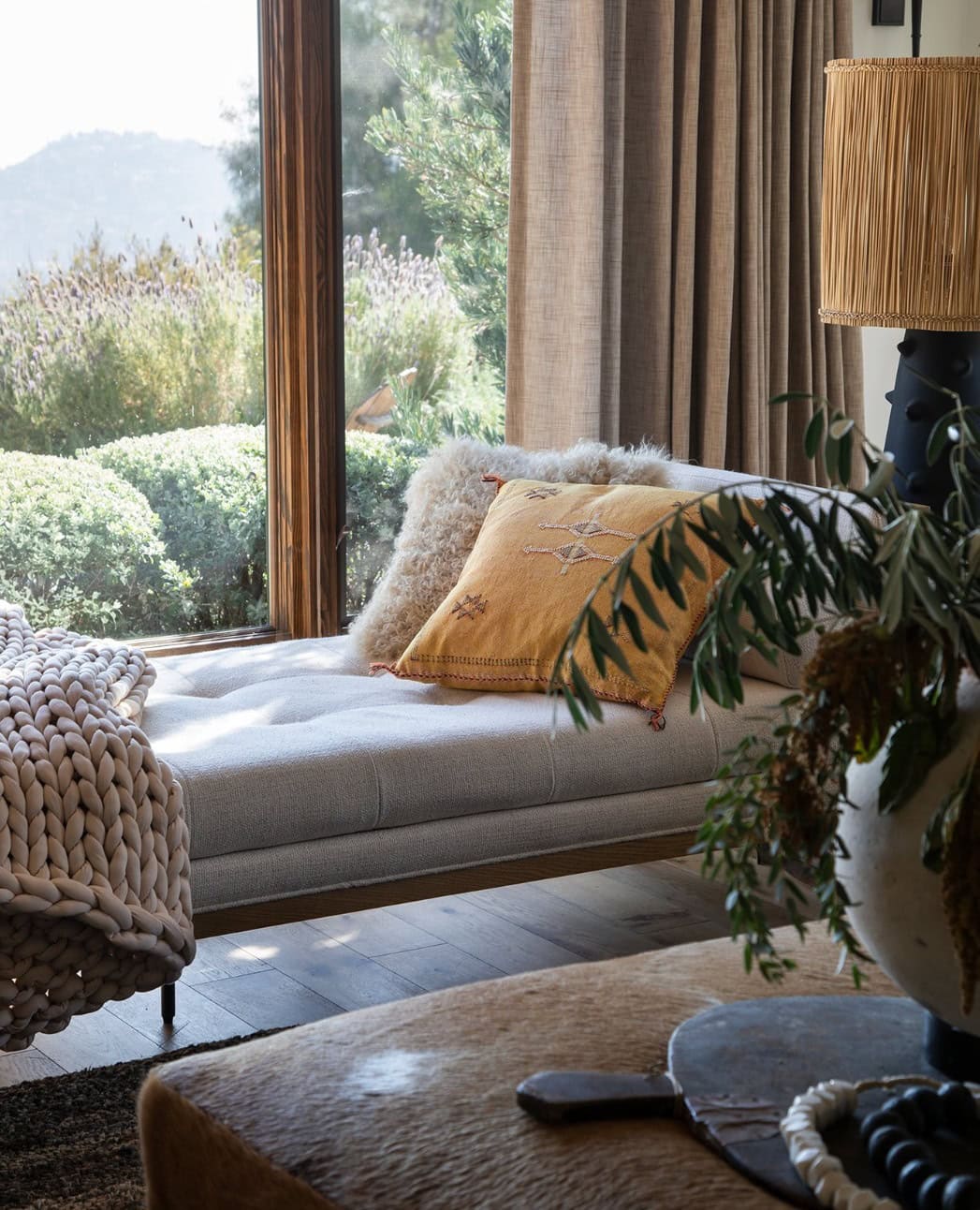 Fall decor for living room idea featuring neutral modern sofa in transitional living room