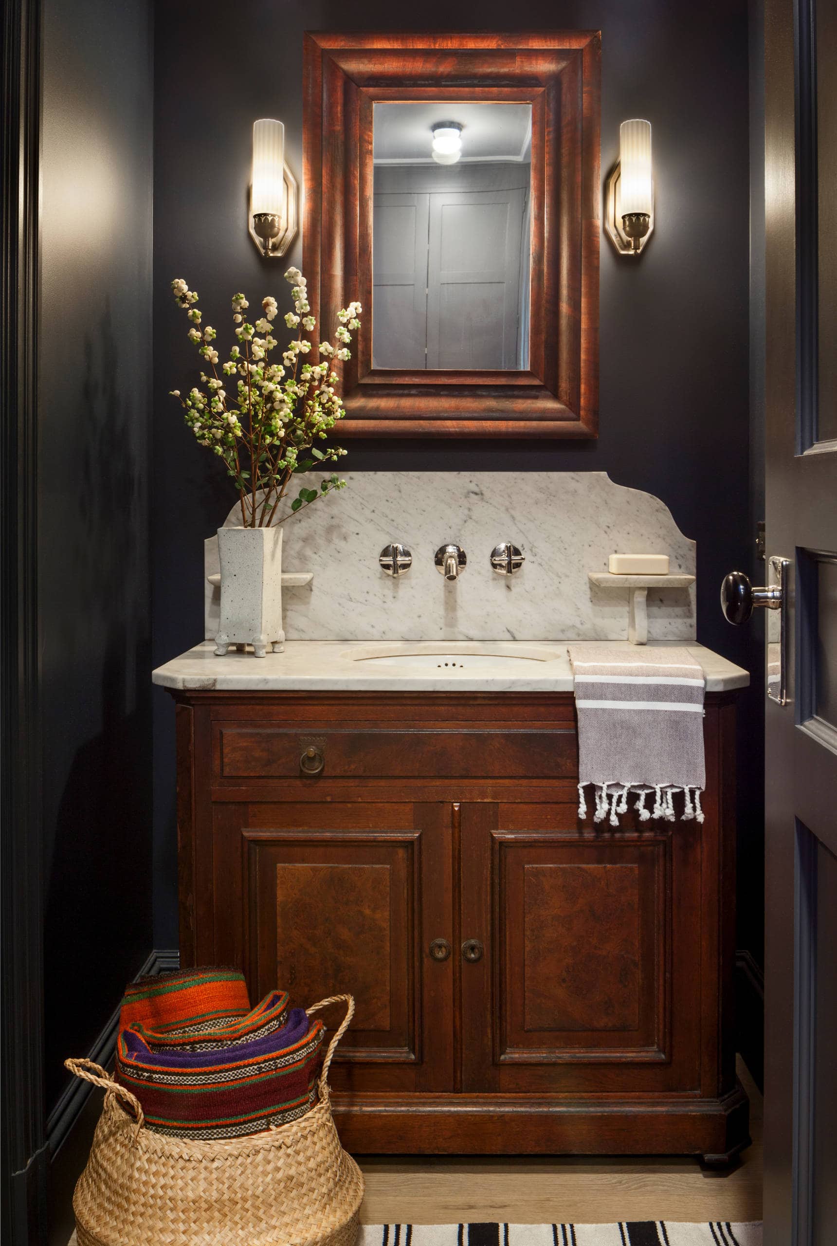 Fall bathroom decor idea featuring dark moody powder room