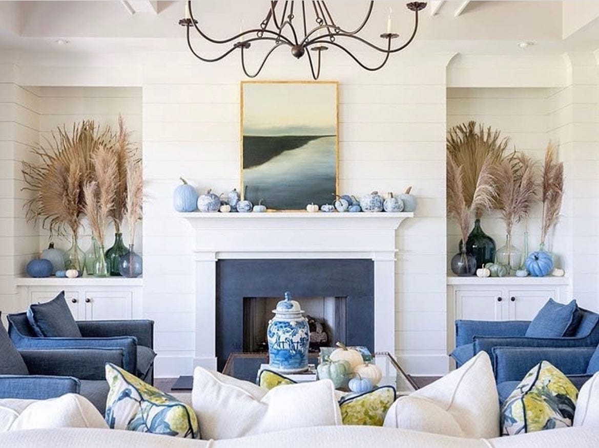 Fall mantel ideas for living room decor featuring a coastal fireplace mantel in blue and white