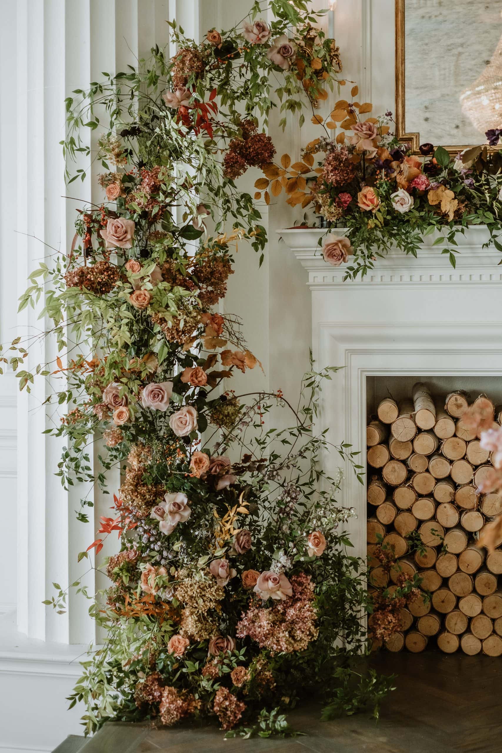 Fall mantel ideas for living room decor featuring a romantic fireplace mantel with florals