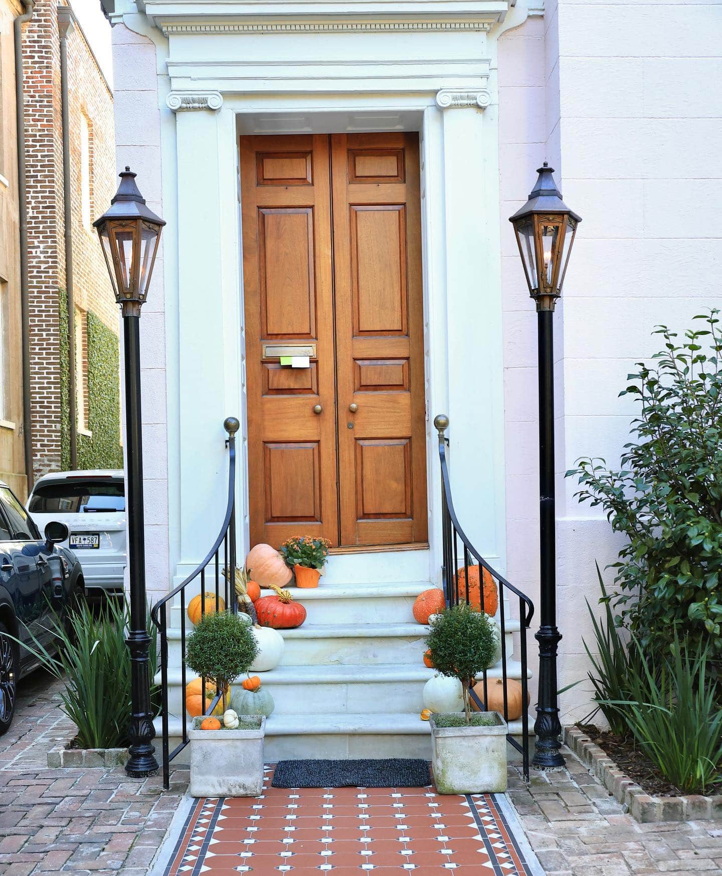 Example of fall porch decorations featuring front door