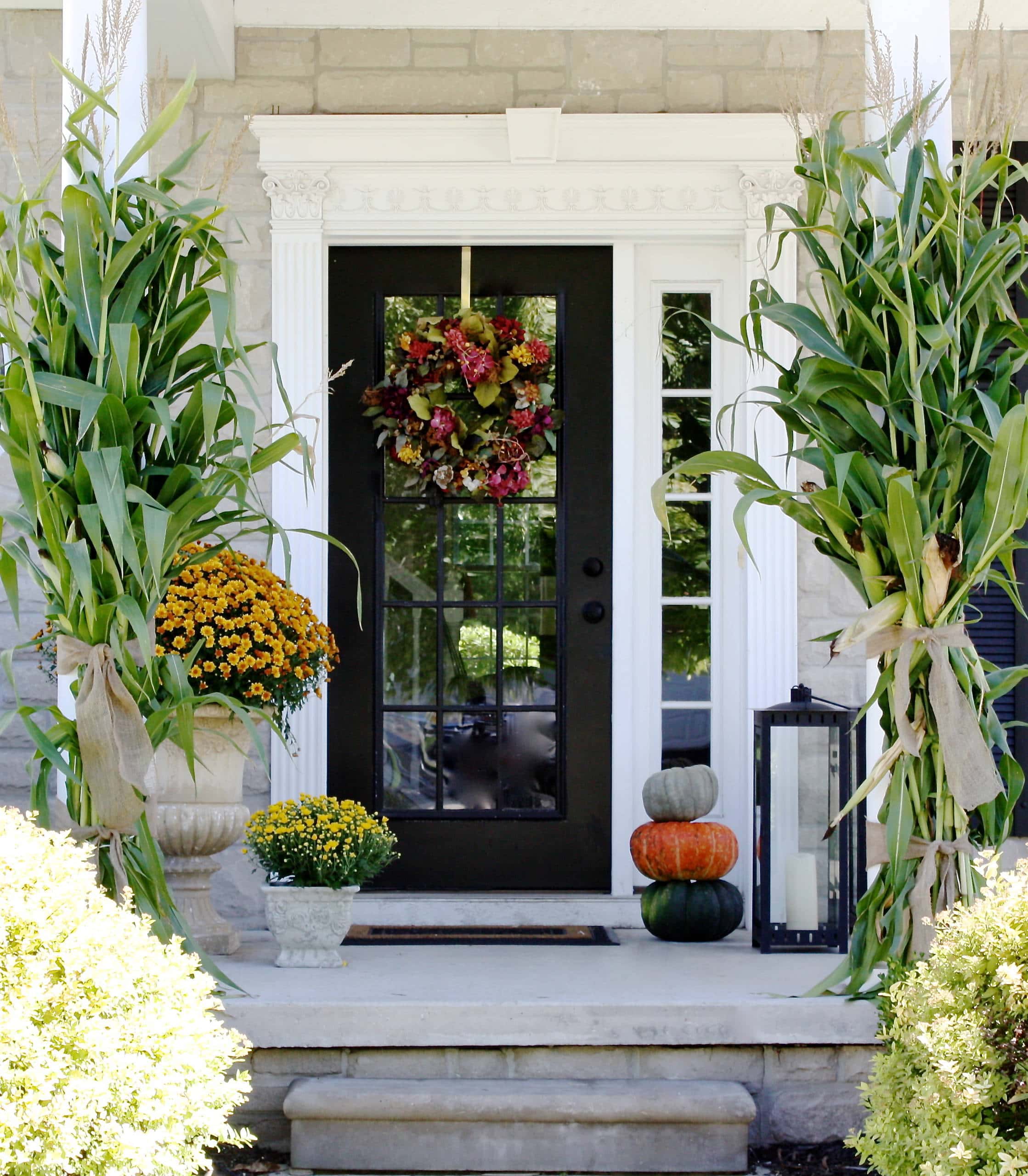 Example of fall porch decorations featuring front door
