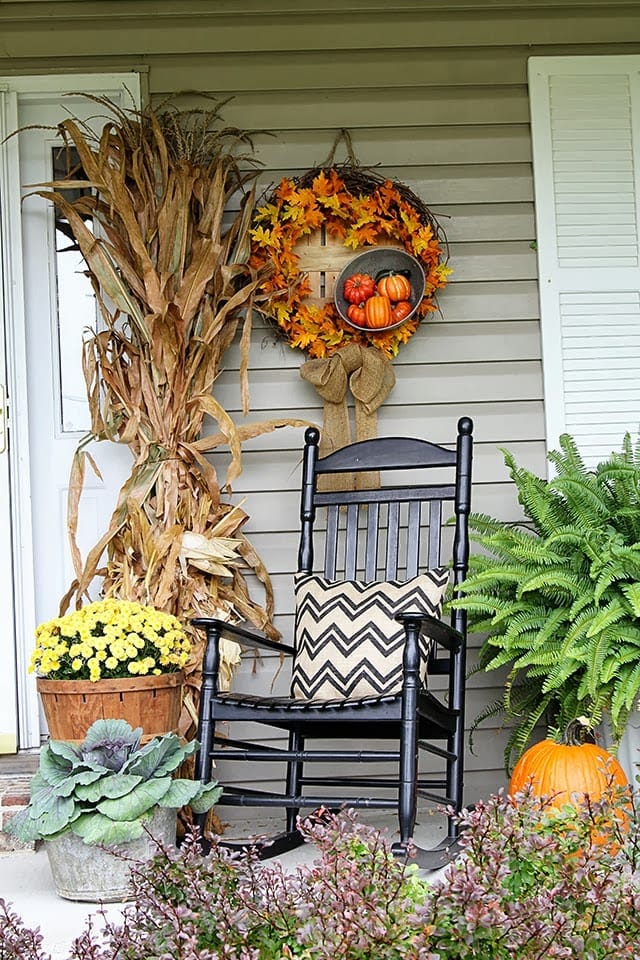 Example of fall porch decorations featuring front porch with rocking chair