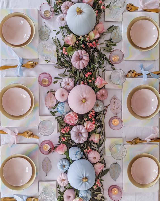 Pink Halloween decorations example featuring dining table with pink and blue pumpkins
