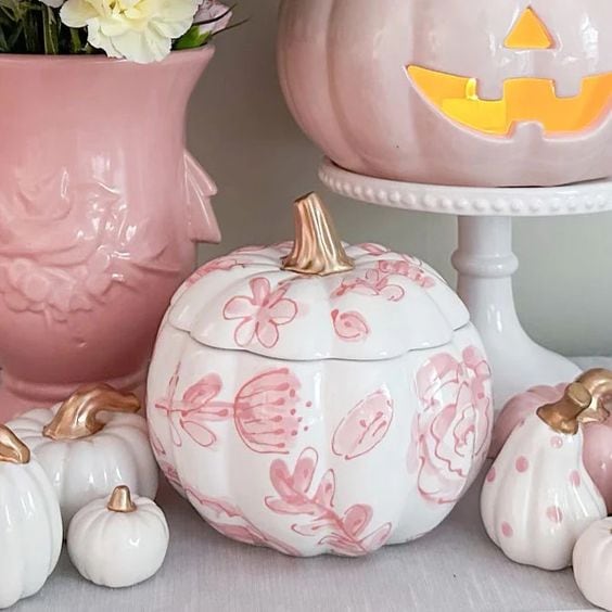 Pink Halloween decorations example featuring an elegant vignette with pink pumpkins