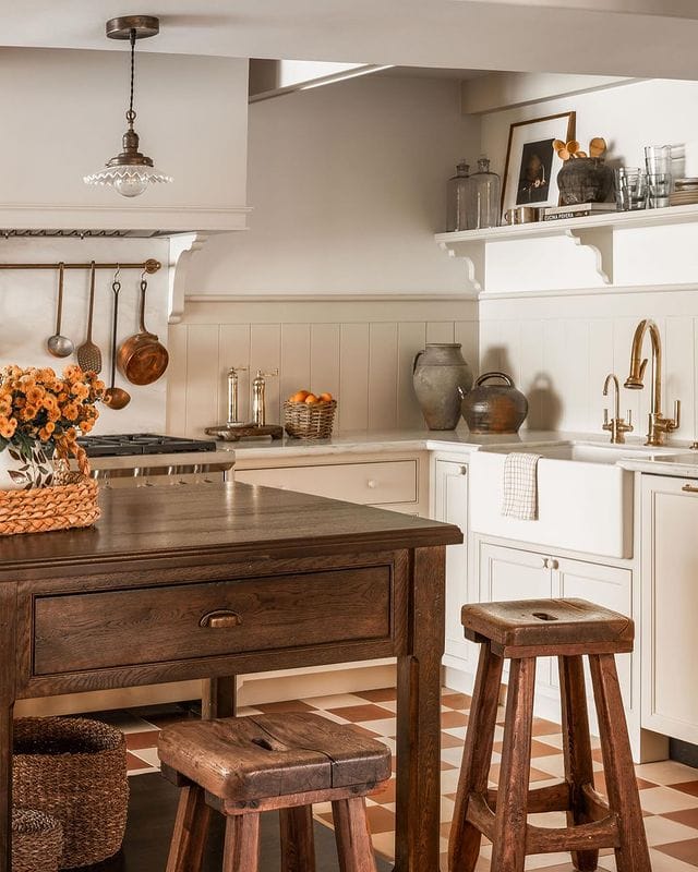 Example of kitchen in cottage style of how to mix metals when decorating